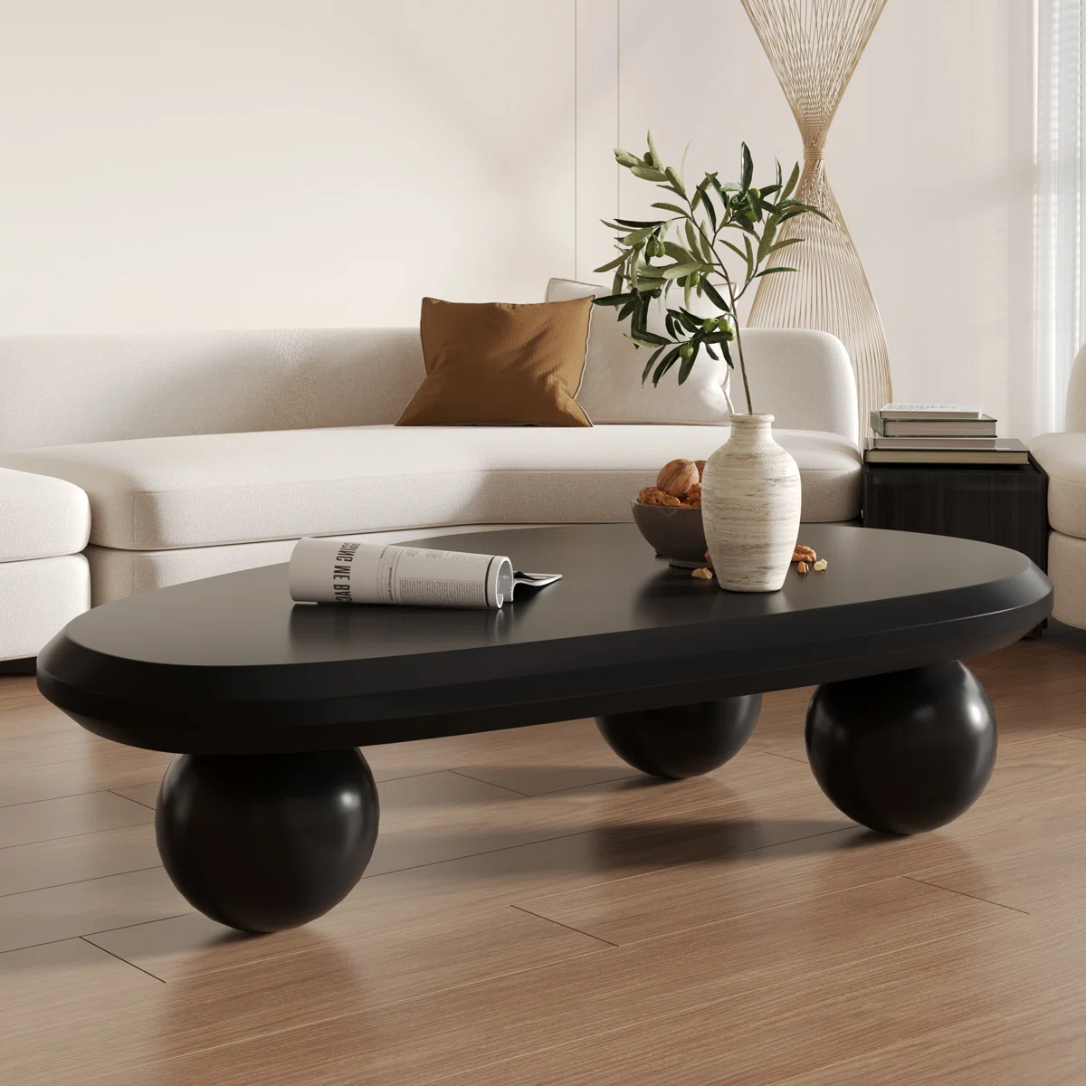 51" Oval Cream Black Brown Modern Coffee Table with Three Round Legs